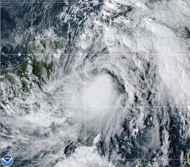 This satellite image provided Sunday by the National Oceanic and Atmospheric Administration shows Tropical Storm Zeta.