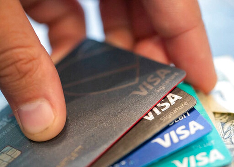 This Aug. 11, 2019 file photo shows Visa credit cards in New Orleans. Almost all of us make a credit mistake from time to time, but some of them have a lot of staying power. Some of the biggest missteps include not making a payment, co-signing a loan and raiding retirement savings to pay off debts. Those are, in many cases, irreversible. (AP Photo/Jenny Kane, File)