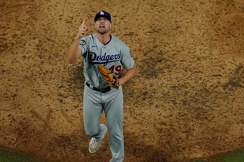 Los Angeles Dodgers relief pitcher Blake Treinen celebrates their win against the Tampa Bay Rays in Game 5 of the baseball World Series Sunday, Oct. 25, 2020, in Arlington, Texas. Dodgers beat the Rays 4-2 to lead the series 3-2 games. (AP Photo/David J. Phillip)