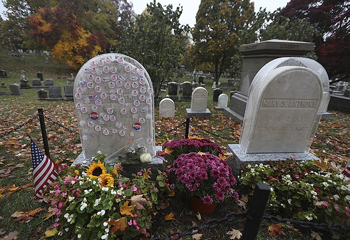 "I Voted Today" stickers cover a protective plastic cover on the headstone of Susan B. Anthony in Mt. Hope Cemetery, Sunday Oct. 25, 2020. in Rochester, N.Y. The Friends of Mt. Hope placed plastic covers Susan and her sister's Mary Anthony's headstone as visitors have placed stickers on them since early voting started Saturday, Oct. 24. (Tina MacIntyre-Yee/Democrat & Chronicle via AP)