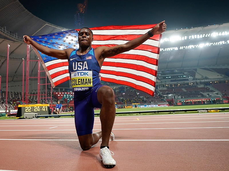 In this  Sept. 28, 2019, file photo, Christian Coleman, of the United States, celebrates winning the gold medal in the men's 100 meter final race at the World Athletics Championships in Doha, Qatar. Men's 100-meter world champion Christian Coleman was banned for two years on Tuesday, Oct. 27, 2020, for missing three doping control tests. Track and field's Athletics Integrity Unit said Coleman will be banned until May 2022, forcing him to miss the Tokyo Olympics next year. (AP Photo/David J. Phillip)