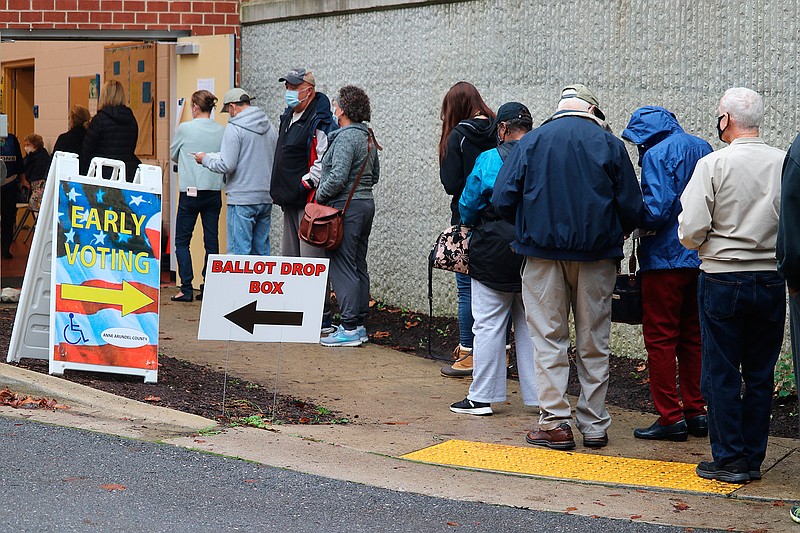 In this Monday, Oct. 26, 2020, file photo, voters wait in line to enter the Pip Moyer Recreation Center, in Annapolis, Md., on the first day of in-person early voting in the state. Tens of millions of Americans already cast ballots in the 2020 election amid record-breaking early voting during the coronavirus pandemic. But for some voters in a handful of states, casting an early ballot in-person isn't even an option. (AP Photo/Brian Witte, File)
