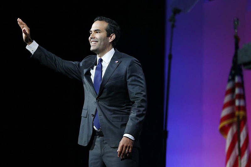 Texas Land Commissioner George P. Bush waves to the crowd during the Texas Republican Convention at Kay Bailey Hutchison Convention Center in Dallas, Texas. (Vernon Bryant/The Dallas Morning News/TNS)