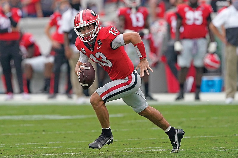 Georgia quarterback Stetson Bennett scrambles during a game earlier this month against Tennessee in Athens, Ga.