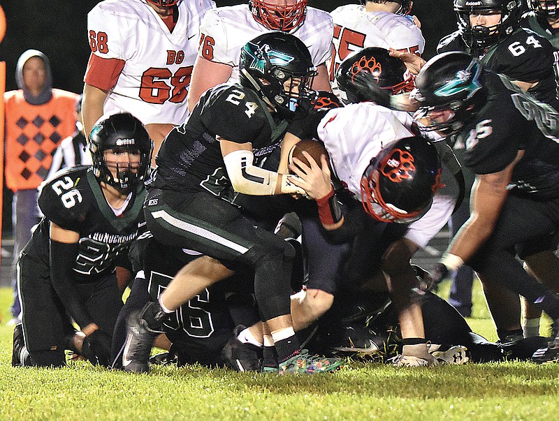 North Callaway safety Cody Cash tries to strip the ball out of the hands of Bowling Green quarterback Dylan Dalton during a game earlier this mont in Kingdom City.