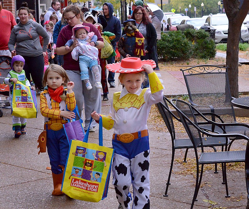 <p style="text-align:right;">News Tribune file</p><p><strong>Mavis Jefferson, 6, and her sister Nala, 5, left, dress as Woody and Jesse from “Toy Story” during the 2019 High Street Trick-Or-Treat event downtown. This year’s event is set for 11 a.m.-2 p.m. Saturday.</strong></p>