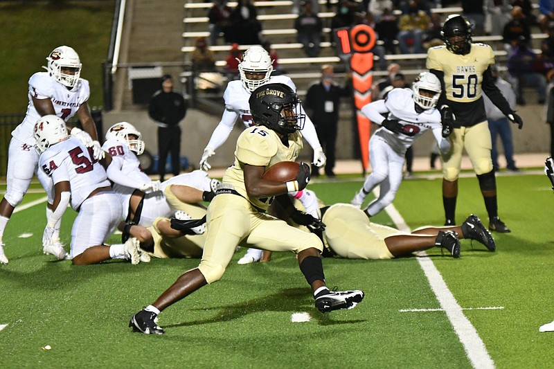 Pleasant Grove's Jaylen Boardley (15) runs past Liberty-Eylau Leopard defenders, including Kanye Federick (60) and Malek Riley (54). The Hawks won, 47-6. (Photo by Kevin Sutton)