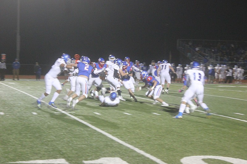 <p>Democrat photo/Kevin Labotka</p><p>California’s defense swarms to the ball Oct. 30 during the Pintos’ loss to Boonville in the first round of district play.</p>