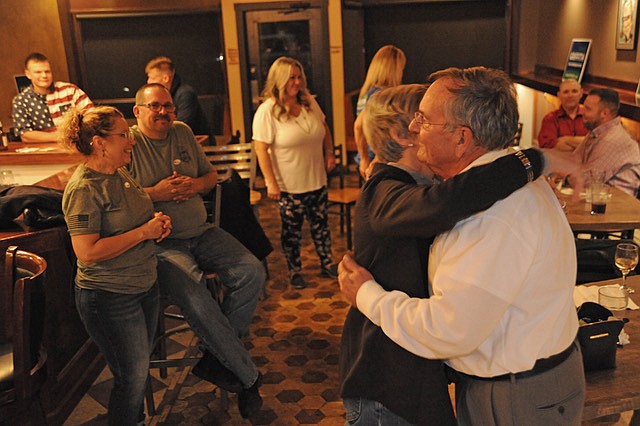 Missouri State Rep. Dave Griffith, right, shares a hug with his wife, Leigh Griffith, after the official announcement was made he had won re-election Tuesday, Nov. 3, 2020.