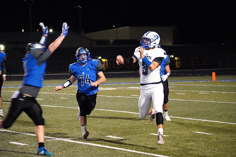 A pair of South Callaway defenders harass the Paris quarterback during the No. 1 seed Bulldogs' 29-14 win over the No. 5 Coyotes in the Class 1, District 2 semifinals Friday night at Mokane.
