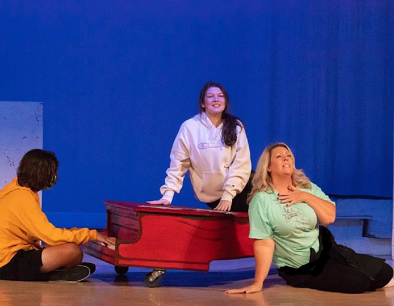 Missy Lyda, director, is seen with Hannah Crook, who plays Lucy, and Keven Sparks, who plays Schroeder, in a rehearsal for New Boston High School's Lion Legacy Theatre production of "You're a Good Man Charlie Brown." (Submitted photo)
