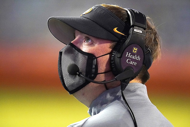 Missouri coach Eli Drinkwitz looks up at the scoreboard during the first half of last month's game against Florida in Gainesville, Fla.