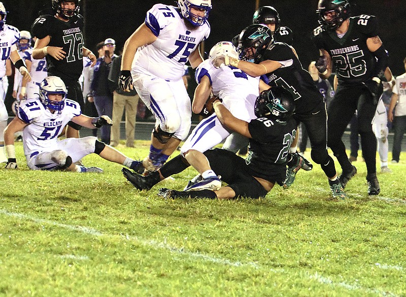 North Callaway junior outside linebacker Manny Moreno (26) and senior safety Cody Cash (24) try to take Montgomery County junior running back Logan Hutcheson to the ground during the Thunderbirds' 50-49 overtime victory over the Wildcats last week in the Class 2, District 5 semifinals at Kingdom City. No. 2 seed North Callaway remains at home to face No. 1 Hallsville in the District 5 championship tonight.
