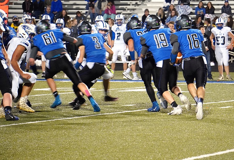 South Callaway senior running back Hayden Vaught (16) follows a block by junior quarterback Sam Buckner (19) during the Bulldogs' 29-14 victory over Paris last week in the Class 1, District 2 semifinals at Mokane. Top-seeded South Callaway hosts No. 2 Mark Twain for the District 2 title tonight.