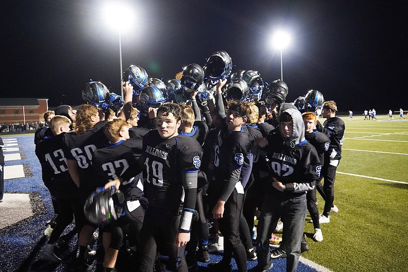 The top-seeded South Callaway Bulldogs celebrate after capturing the Class 1, District 2 title with a 26-6 victory over the Mark Twain Tigers on Friday night at Mokane. South Callaway (7-3) will host third-ranked Thayer (10-1) in the Class 1 state quarterfinals next Saturday.