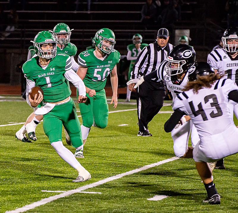 Blair Oaks quarterback Dylan Hair takes off running Friday in the Class 3 District 4 championship game against Centralia at the Falcon Athletic Complex in Wardsville.