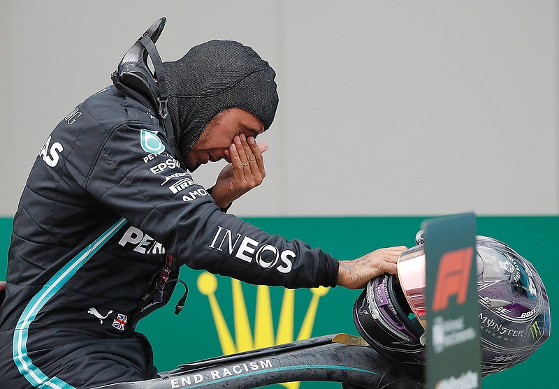 Lewis Hamilton reacts Sunday after winning the Turkish Formula One Grand Prix at the Istanbul Park circuit racetrack in Istanbul.