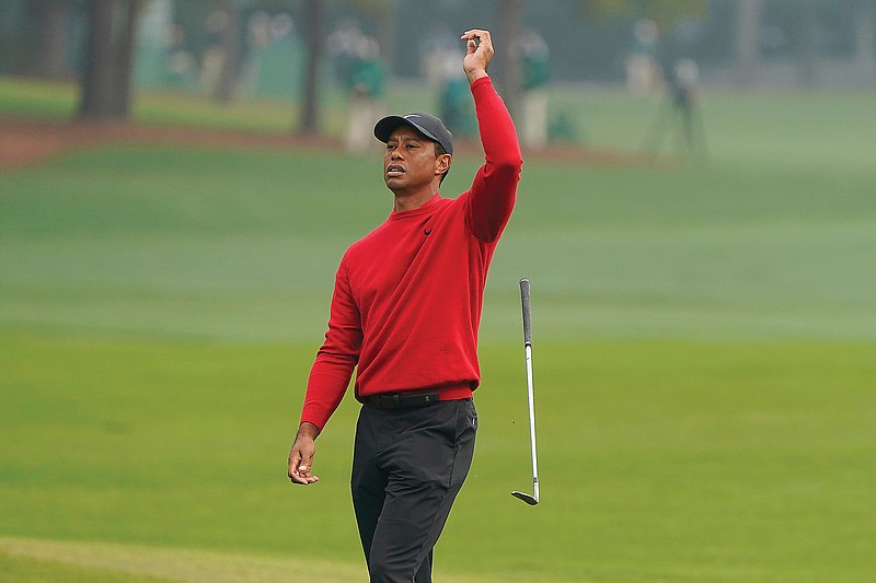 Tiger Woods reacts after a near chip in on the second hole during Sunday's final round of the Masters in Augusta, Ga.