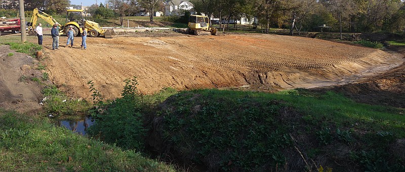  This is the view of a Linden Economic Development Corporation project looking from South Main toward a drainage creek and site of a former meat locker plant. The area is being made ready for topsoil and grass to create community public space in Linden.
