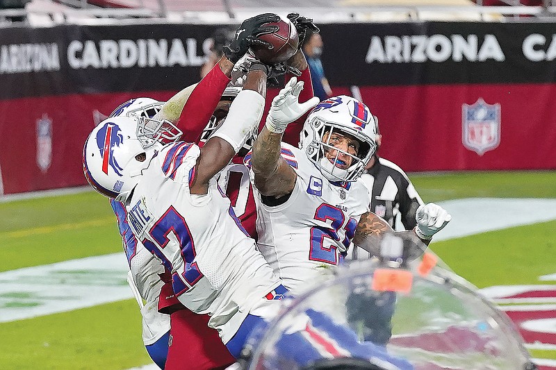 Cardinals wide receiver DeAndre Hopkins catches the game-winning touchdown among three Bills defenders in the final seconds of Sunday's game in Glendale, Ariz.