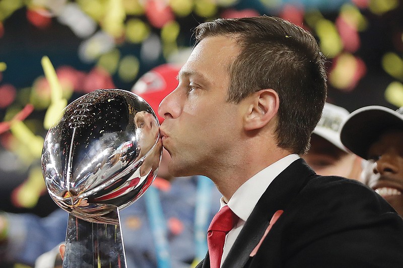 In this Feb. 2 file photo, Chiefs general manager Brett Veach kisses the trophy after Kansas City defeated the San Francisco 49ers in Super Bowl 54 in Miami Gardens, Fla.