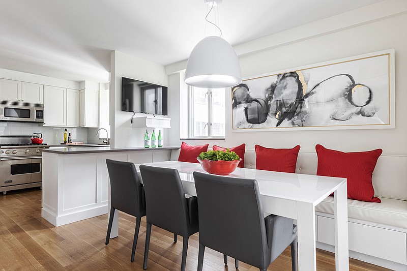 Ruby red helps add an instant burst of color to this kitchen space. (Design Recipes/TNS)