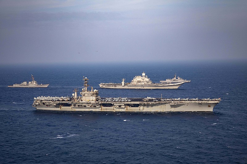 Aircraft carriers and warships participate in the second phase of Malabar naval exercise, a joint exercise comprising of India, US, Japan and Australia, in the Northern Arabian Sea on Tuesday, Nov. 17, 2020. The four countries form the Quadrilateral Security Dialogue, or the Quad. (Indian Navy via AP)