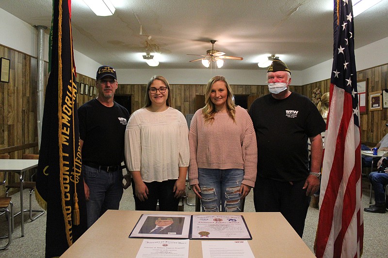 <p>Austin Hornbostel/For the News Tribune</p><p>Moniteau County’s VFW Post No. 4345 celebrated its 75th anniversary last week. Students Shaye Siegel, left center, and Camryn Schlup, right center, received scholarship awards at the event, presented to them by post Quartermaster Tom Winters, far left, and post Commander Jim Hamilton, far right.</p>