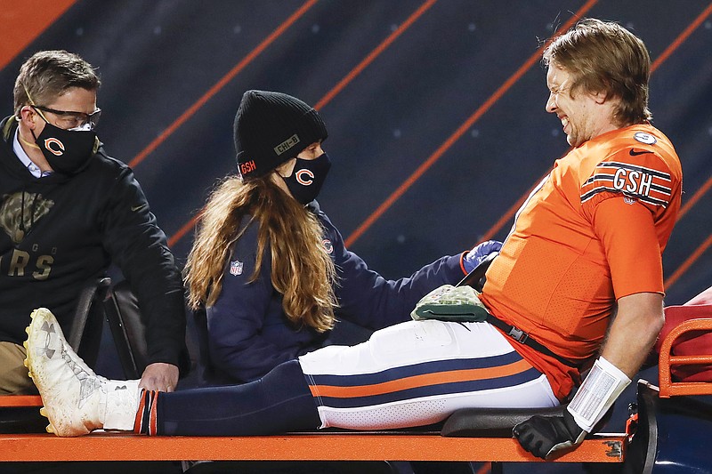 Bears quarterback Nick Foles is taken off on a cart after being injured during the second half of Monday night's game against the Vikings in Chicago.