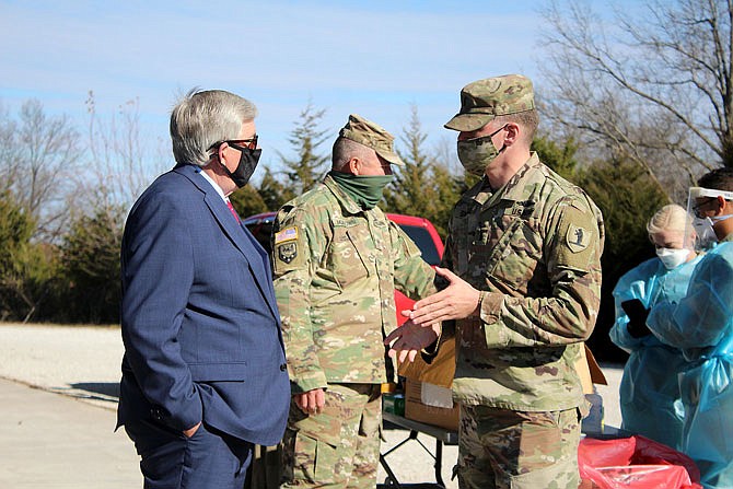 Gov. Mike Parson hears Tuesday about the testing efforts of the Missouri National Guard in Callaway County.
