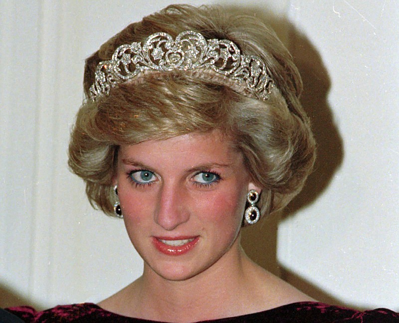 FILE - In this file photo dated Nov. 7, 1985, Britain's Princess Diana wears the Spencer tiara as she and Prince Charles attend state dinner at Government House in Adelaide, Austraila.  The BBC’s board of directors has announced Wednesday Nov. 18, 2020, the appointment of a retired senior judge to lead an independent investigation into the circumstances around a controversial 1995 TV interview with Princess Diana.  (AP Photo/Jim Bourdier, FILE)