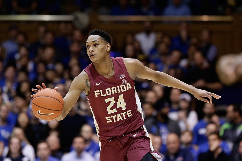 In this Feb. 10, 2020, file photo, Florida State guard Devin Vassell (24) dribbles against Duke during the first half of an NCAA college basketball game in Durham, N.C. Vassell was selected by the San Antonio Spurs in the NBA draft Wednesday, Nov. 18, 2020. (AP Photo/Gerry Broome, File)