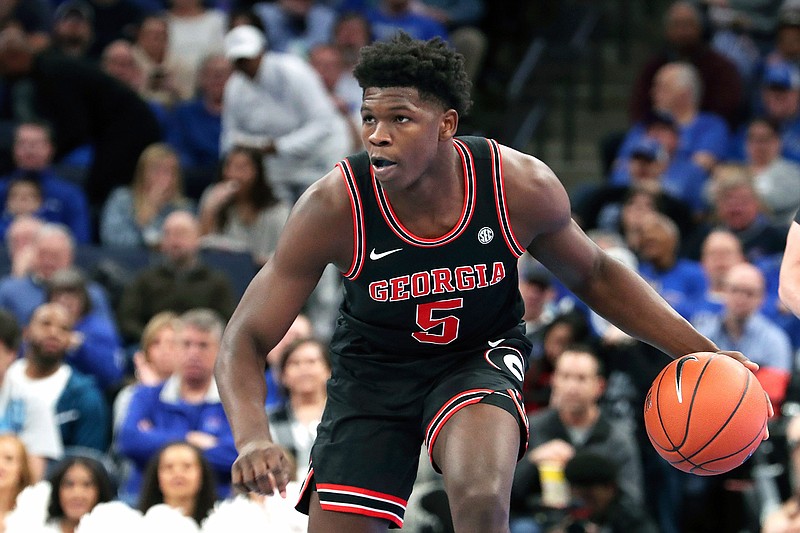 In this Jan. 4, 2020, file photo, Georgia's Anthony Edwards (5) looks to pass the ball during the second half of the team's NCAA college basketball game against Memphis in Memphis, Tenn. The Minnesota Timberwolves selected Edwards with the first pick in the NBA draft Wednesday, Nov. 18. (AP Photo/Karen Pulfer Focht, File)