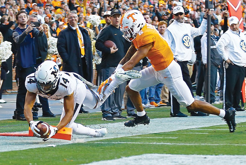 In this Nov. 17, 2018, file photo, Missouri wide receiver Dominic Gicinto dives into the end zone for a touchdown as he's defended by Tennessee's Alontae Taylor during a game in Knoxville, Tenn.