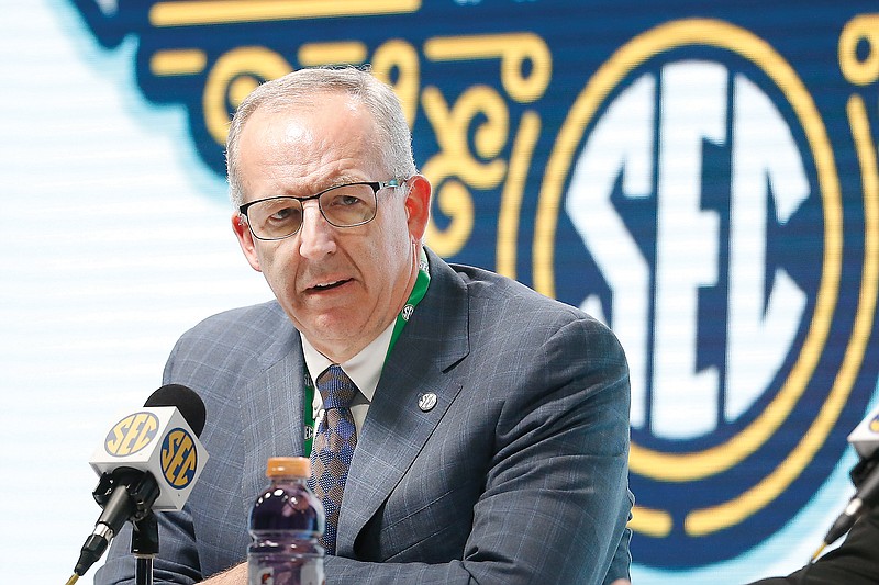 In this March 11 file photo, Southeastern Conference commissioner Greg Sankey announces fans will not be allowed in the arena to watch games in the SEC basketball tournament in Nashville, Tenn.