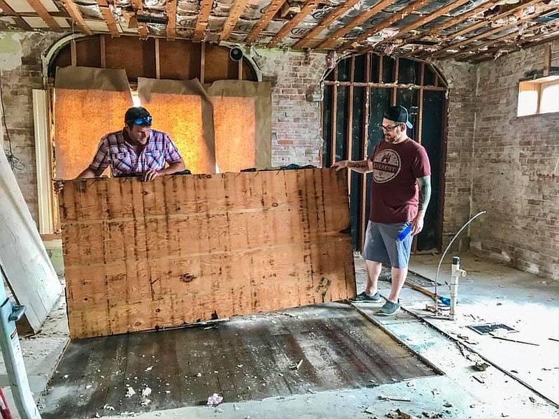 Anthony Rudkin and Will Johns renovate the building at 101 S. U.S. 63 in Freeburg, which will house 1905 Tavern. As part of the renovations, the owners of 1905 Tavern are uncovering the original pine flooring of the building, constructed in 1905.