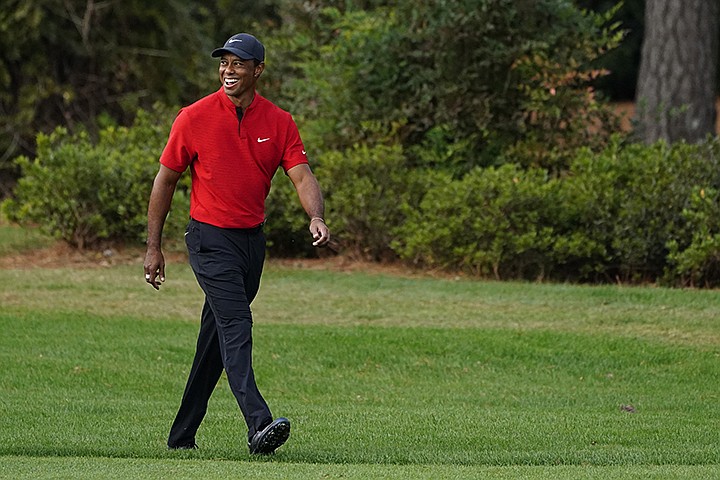 Tiger Woods walks up the 17th fairway during the final round of the Masters golf tournament Sunday, Nov. 15, 2020, in Augusta, Ga. (AP Photo/Matt Slocum)