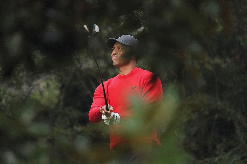 Tiger Woods watches his tee shot on the second hole during last Sunday's final round of the Masters in Augusta, Ga.