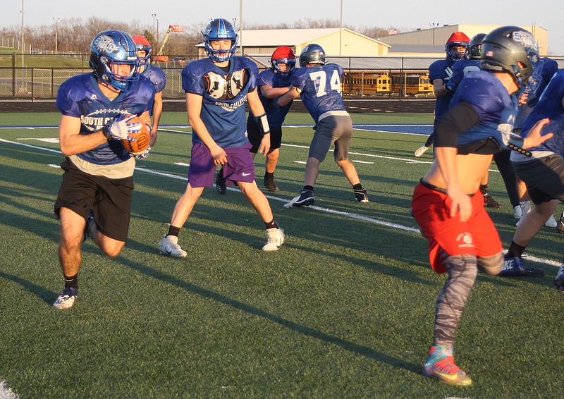 South Callaway senior running back Hayden Vaught carries the ball on a sweep during the Bulldogs' practice Thursday afternoon at the high school at Mokane. South Callaway (7-3) hosts the third-ranked Thayer Bobcats (10-1) in the Class 1 state quarterfinals at 1 p.m. today.