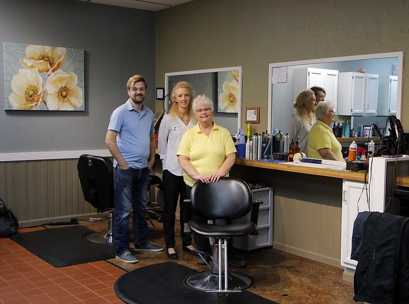 Liv Paggiarino/News Tribune

The staff of Big Angie’s Salon stand for a portrait on Nov. 19 in their new space along Missouri Boulevard. 