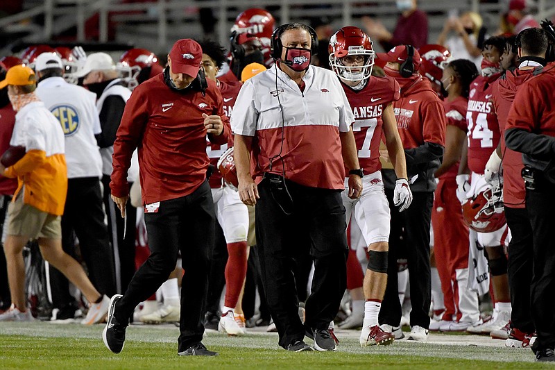 Arkansas coach Sam Pittman walks the sideline during the first half of the team's NCAA college football game against Tennessee on Saturday, Nov. 7, 2020, in Fayetteville, Ark. (AP Photo/Michael Woods)