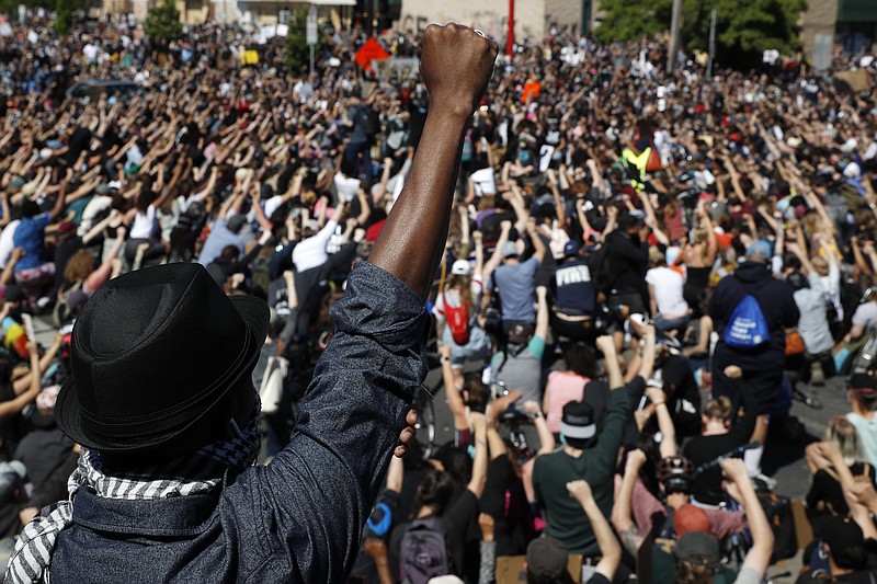 FILE - In this May 30, 2020, file photo, protesters gather in Minneapolis. Almost six months after the death of George Floyd, criminal justice reform advocates are cheering multiple victories in the 2020 election. (AP Photo/John Minchillo, File)