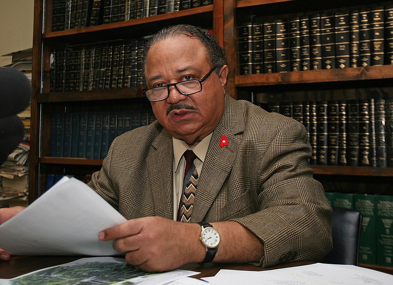 In this June 16, 2010, file photo, Rep. Alvin Holmes, D-Montgomery talks to reporters at his Montgomery, Ala., office. Former Rep. Holmes has died at the age of 81. Holmes had been the longest-serving member of the Alabama House of Representatives before his defeat in 2018.  State House of Representatives spokesman Clay Redden confirmed Holmes' death Saturday, Nov. 21, 2020. (AP Photo/Jamie Martin, File)