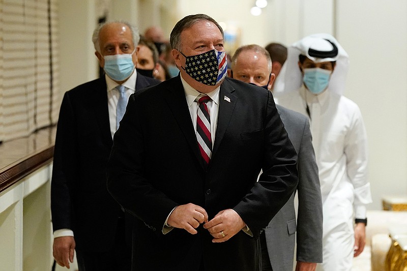 Secretary of State Mike Pompeo walks into a meeting with the Taliban's peace negotiation team amid talks between the Taliban and the Afghan government, Saturday, Nov. 21, 2020, in Doha, Qatar. (AP Photo/Patrick Semansky, Pool)