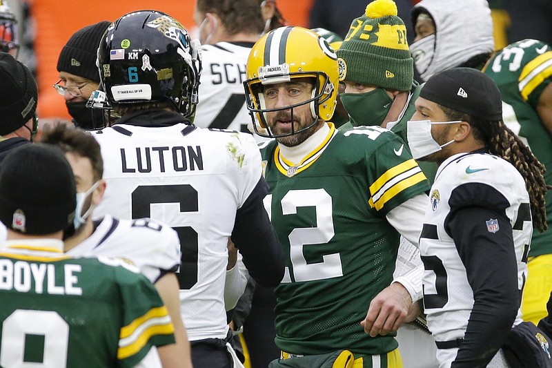 Packers quarterback Aaron Rodgers talks to Jaguars quarterback Jake Luton after last Sunday's game in Green Bay, Wis.