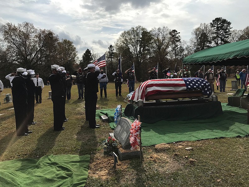 Vietnam veterans stand in tribute U.S. Navy veteran Samuel Cyrus Steiner during a funeral and burial service Saturday at Camp Ground Cemetery near Winthrop, Ark. Steiner's remains were discovered and identified earlier this year before being returned home to Arkansas. He was serving aboard the battleship U.S.S. Oklahoma during the Dec. 7, 1941, attack on Pearl Harbor.
