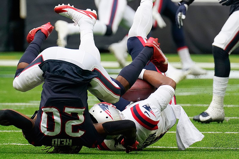 New England Patriots quarterback Cam Newton (1) is sacked by Houston Texans strong safety Justin Reid (20) during the second half of an NFL football game, Sunday, Nov. 22, 2020, in Houston. (AP Photo/David J. Phillip)