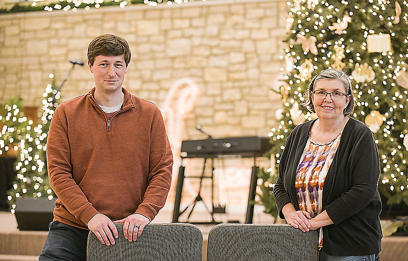 First United Methodist Church Pastor Trevor Dancer, left, and Associate Pastor Karen Taylor pose in the Monroe Street sanctuary after recording messages of hope. The messages will soon be uploaded for local hospital staffers to view for encouragement. 