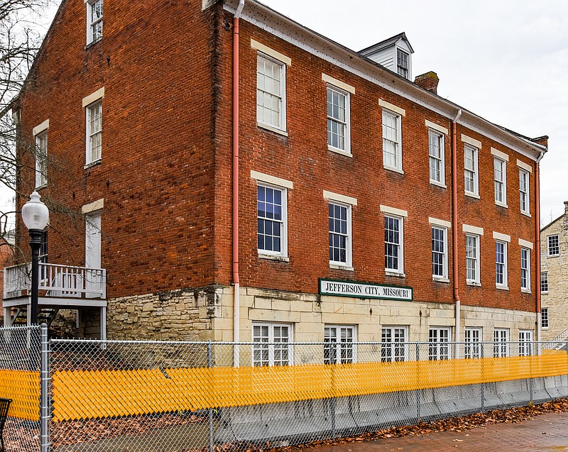 A fence currently encloses the back of the Union Hotel to prevent entrance to the building. Missouri officials have announced that the former Union Hotel, the old stone and brick building located at the north end of Jefferson Street near the railroad tracks, will remain closed for the foreseeable future. State officials announced Friday that due to lack of funds to make the necessary repairs and renovations, the building, which houses an art gallery upstairs and Amtrak station downstairs, will remained closed due to safety concerns.