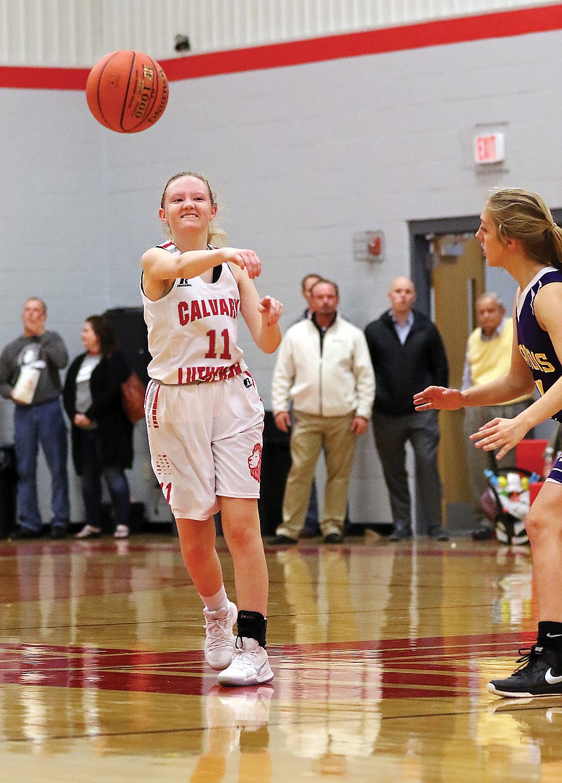 Calvary Lutheran's Rachel Thompson throws a pass in a game last season with Chamois at Calvary Lutheran.